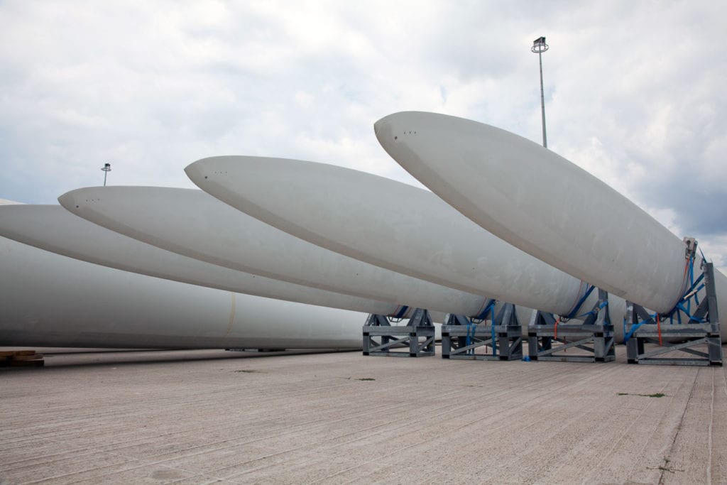 Giant wind turbine awaiting assembly at wind farm